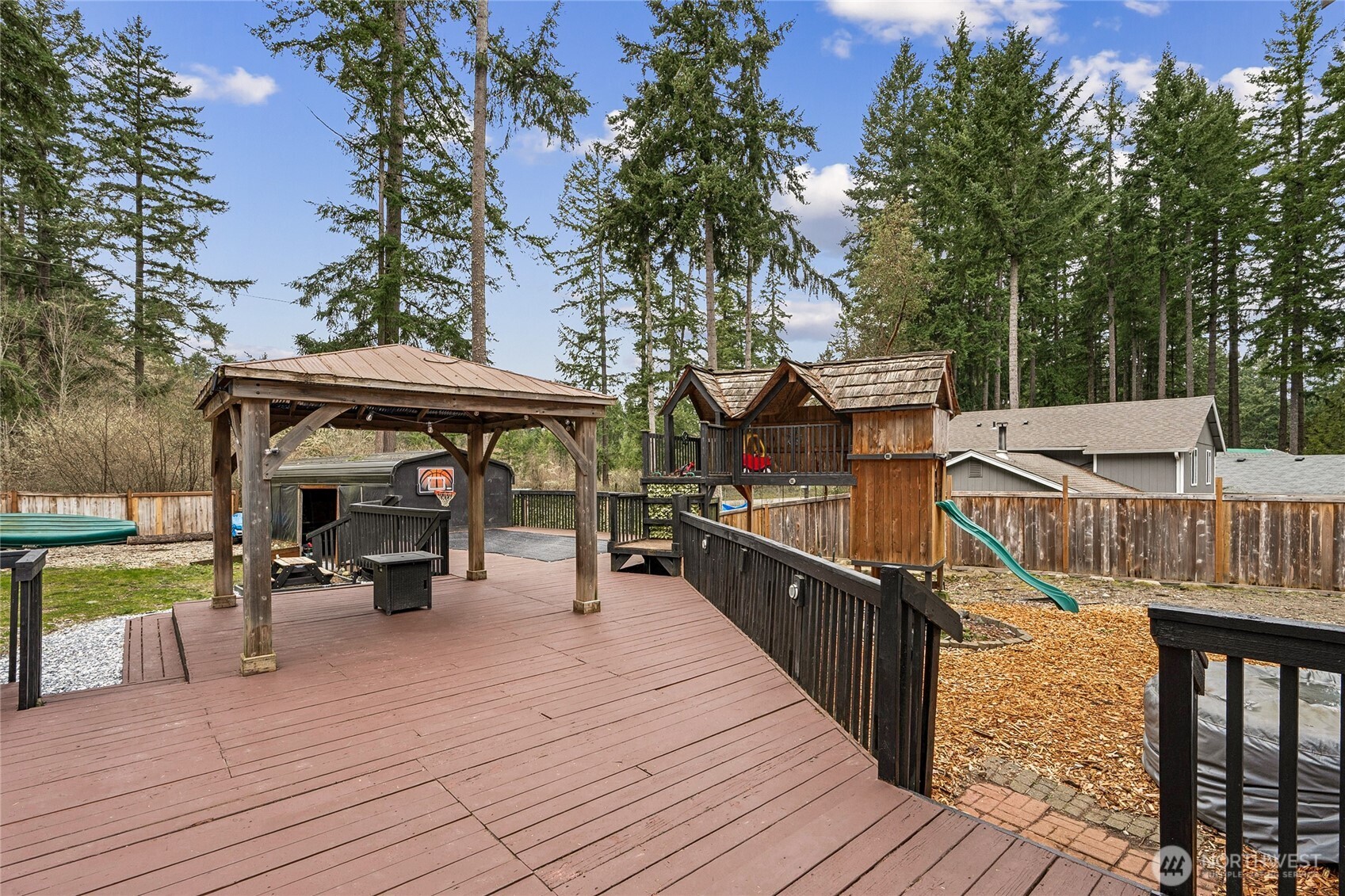 17535 Loop Lane Southeast Yelm, WA 98597 - Photo 27 of 30 a view of a deck with furniture and trees