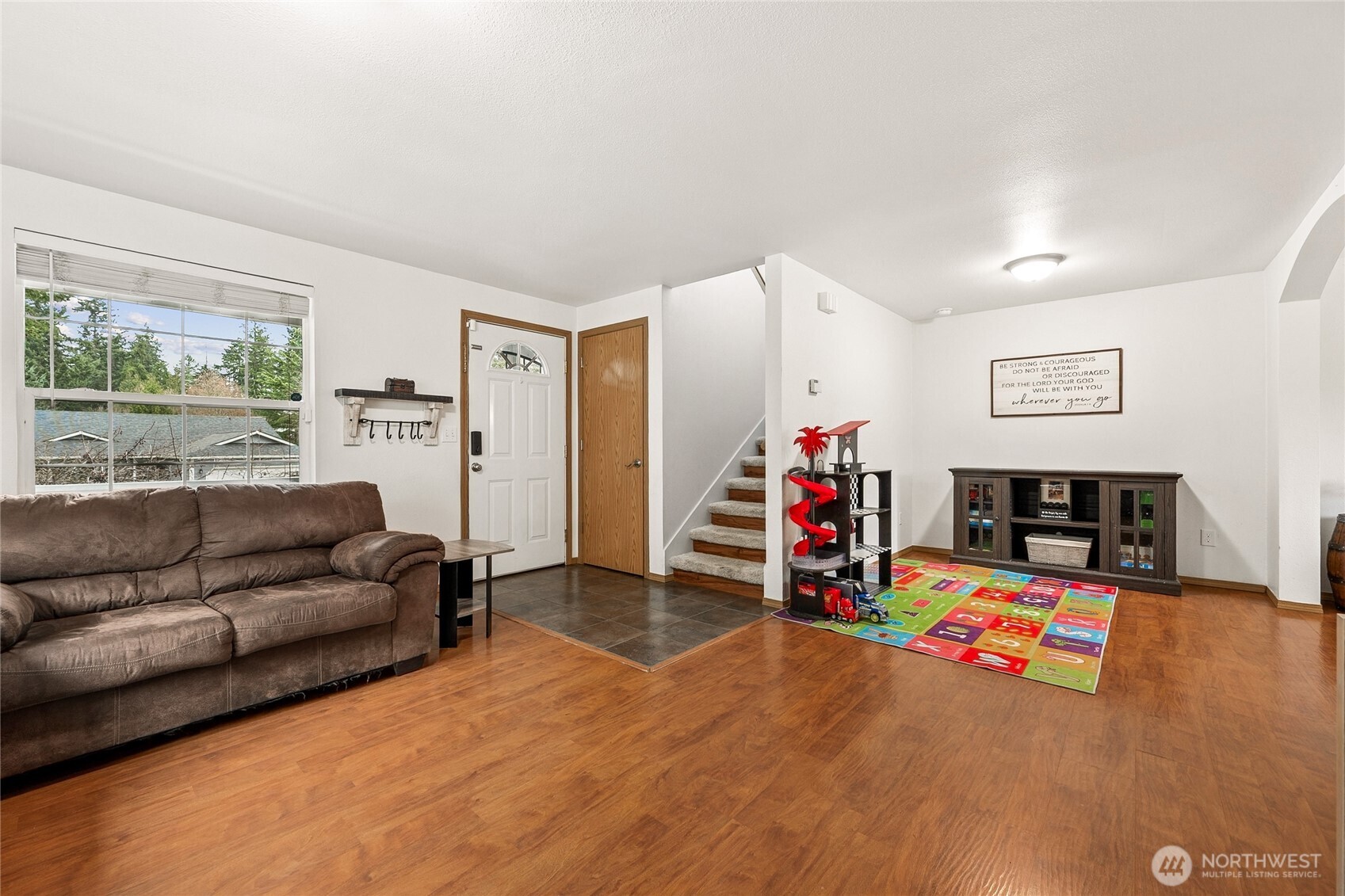 17535 Loop Lane Southeast Yelm, WA 98597 - Photo 6 of 30 a living room with furniture and a flat screen tv