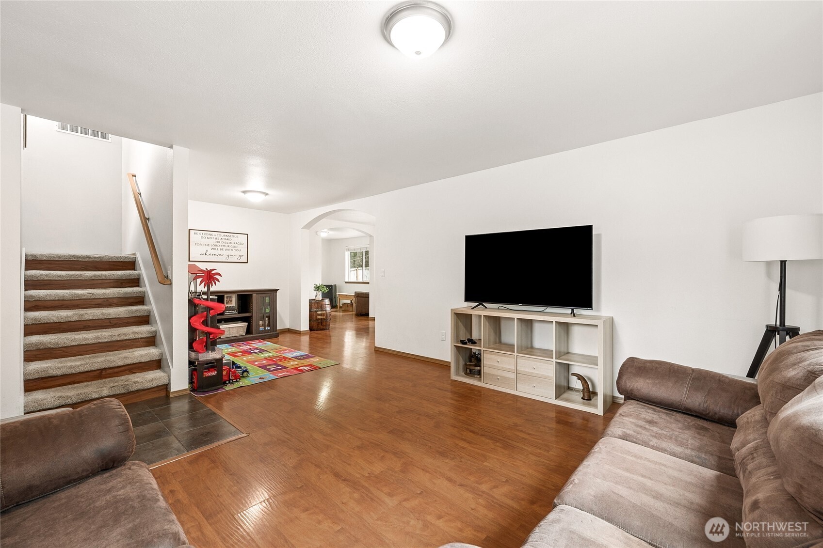 17535 Loop Lane Southeast Yelm, WA 98597 - Photo 7 of 30 a living room with furniture and a flat screen tv