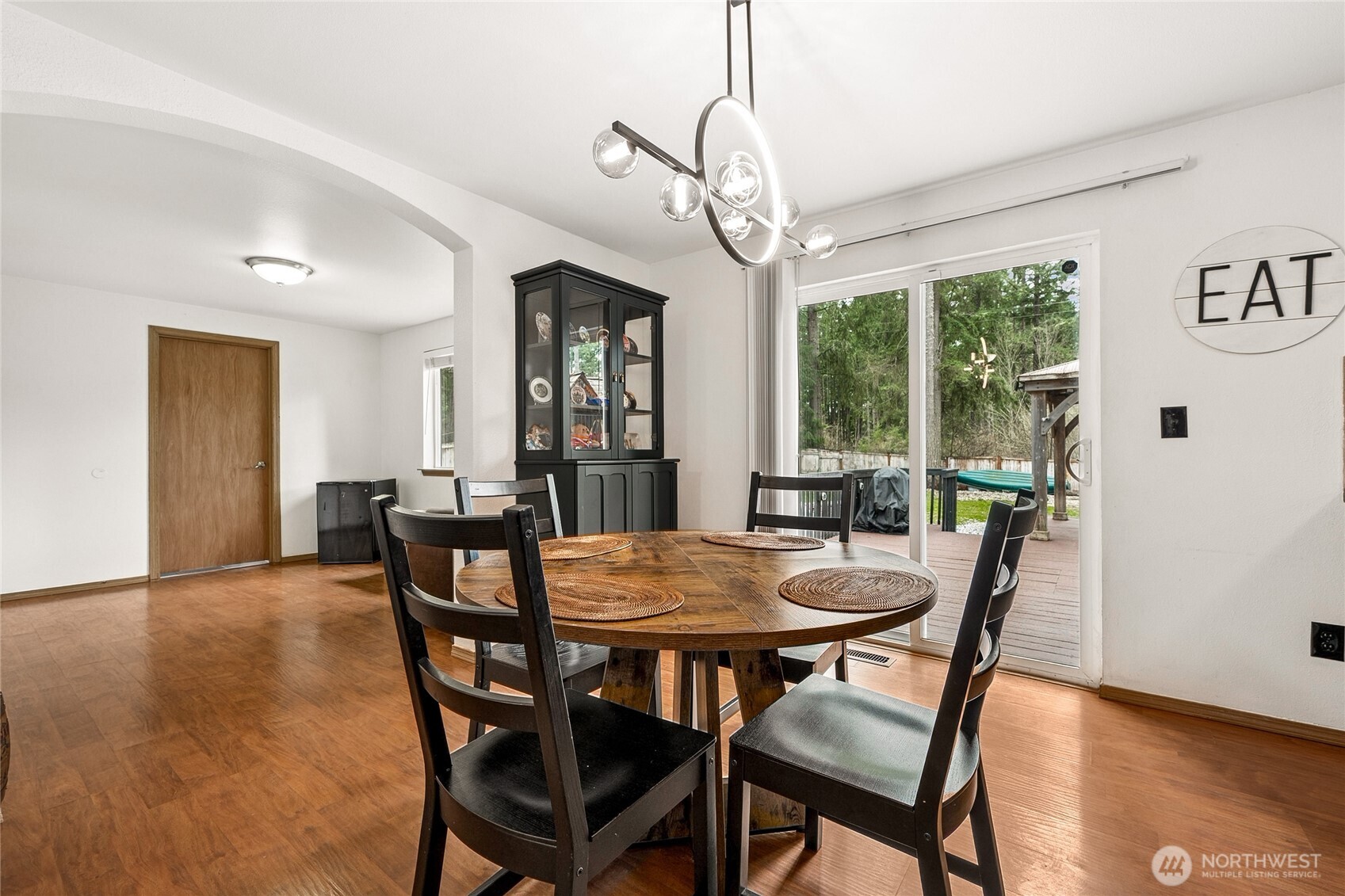 17535 Loop Lane Southeast Yelm, WA 98597 - Photo 10 of 30 a view of a dining room with furniture window and wooden floor
