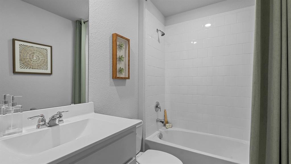 16421 Hudson Pr Way Justin, TX 76247 - Photo 25 of 39 a bathroom with a bathtub shower sink and toilet