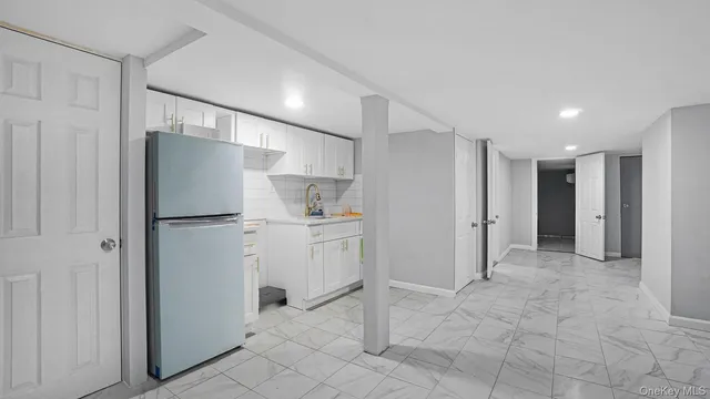 a view of a refrigerator in kitchen and furniture