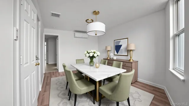 a dining room with furniture and window