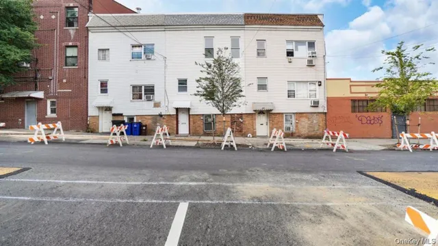 an aerial view of multiple houses with a swimming pool