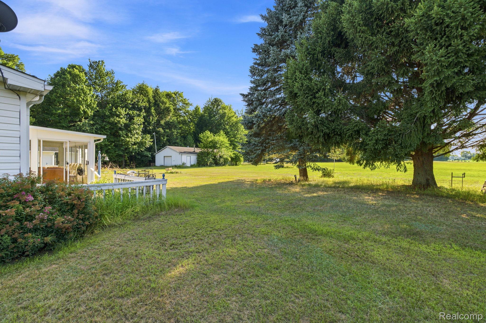 2390 Lakeshore Road Applegate, MI 48401 - Photo 79 of 97 Expansive grounds featuring a manicured lawn with mature shade trees and open acreage