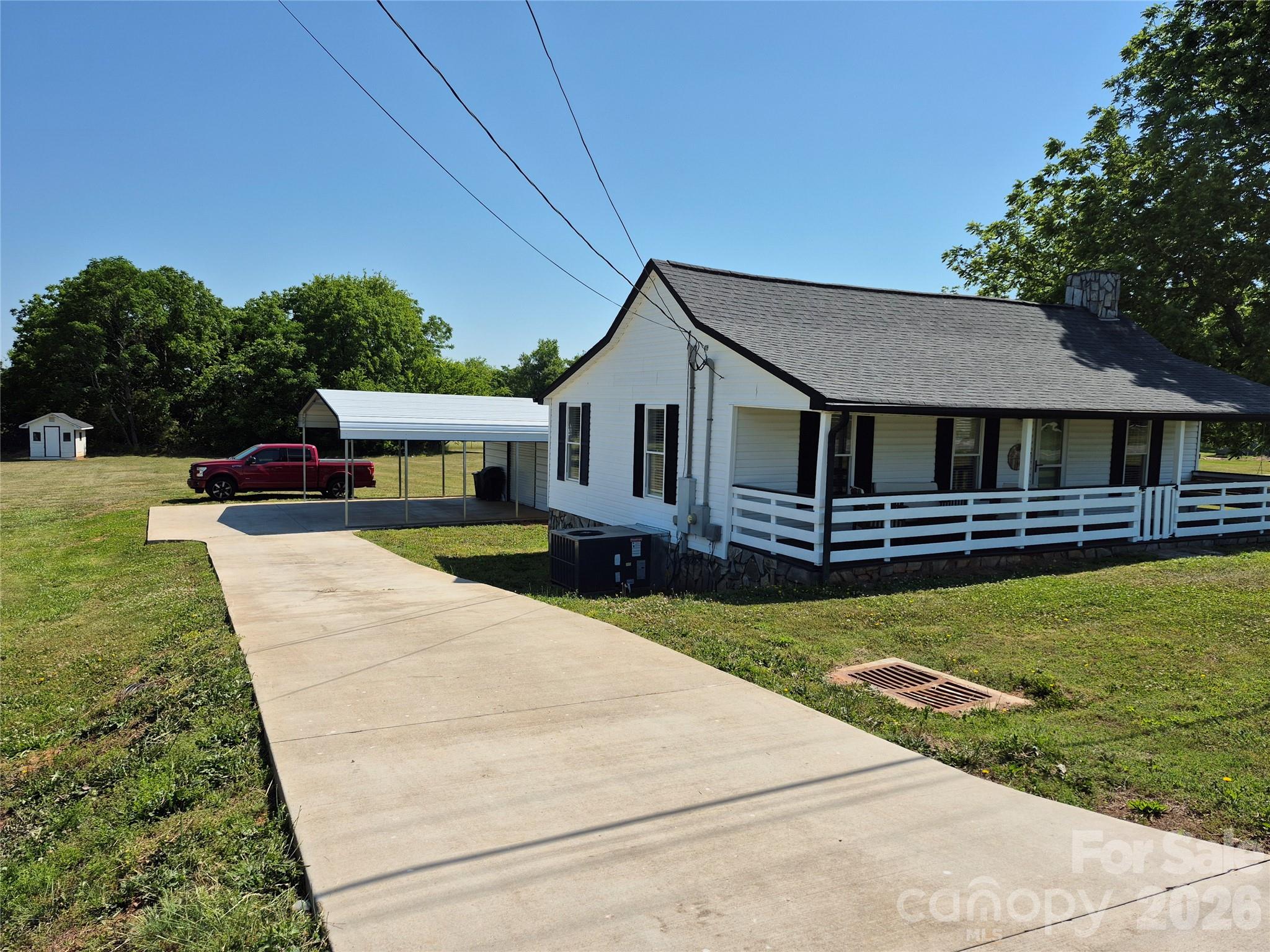 4438 Reepsville Road Vale, NC 28168 - Photo 2 of 32 a house with garden in front of it