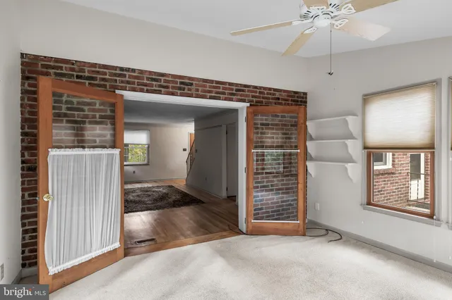a dining room with wooden floor and breakfast area