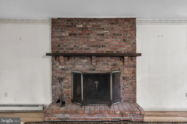 a living room with fireplace