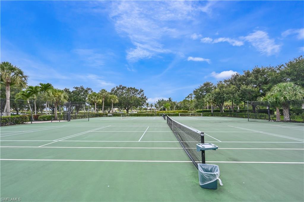 7915 Mahogany Run Lane, Unit 1115 Naples, FL 34113 - Photo 11 of 39 a view of a tennis court