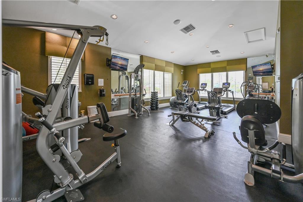 7915 Mahogany Run Lane, Unit 1115 Naples, FL 34113 - Photo 14 of 39 a gym room with lots of gym equipment