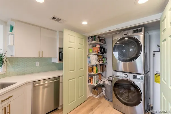 a view of a kitchen with washer and dryer
