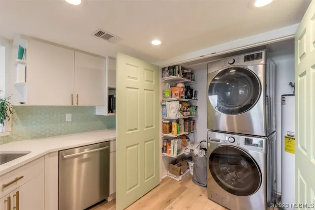 a view of a kitchen with washer and dryer