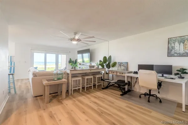 a workspace with furniture hardwood and a window