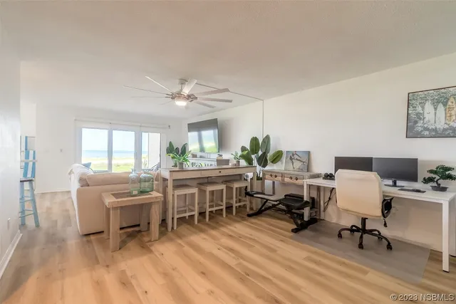 a workspace with furniture hardwood and a window