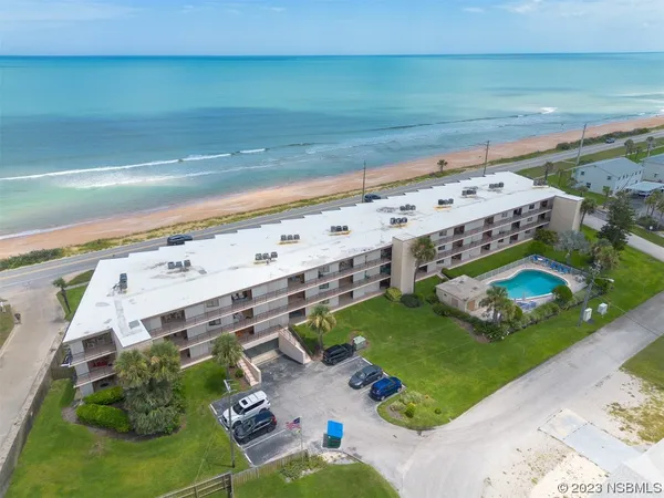 a view of a swimming pool with an outdoor seating area