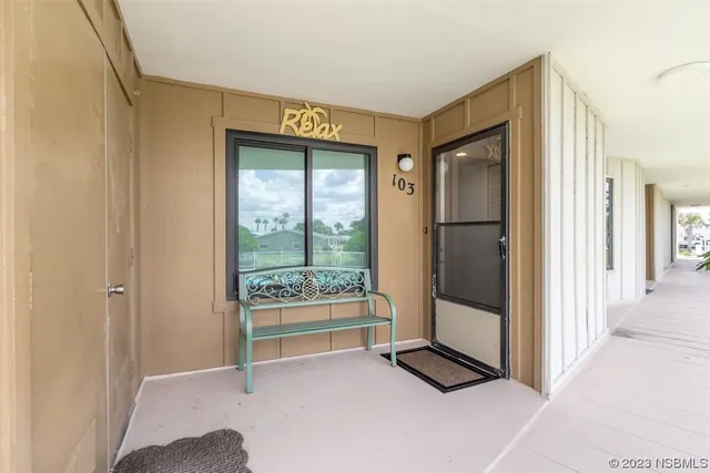 a view of a livingroom with wooden floor and window