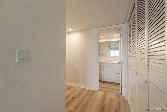 an empty room with mirror