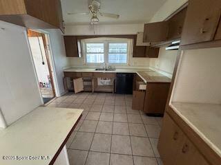 963 Brookview Lane Rockledge, FL 32955 - Photo 3 of 14 a kitchen with granite countertop a stove a sink and a refrigerator