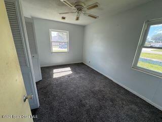 963 Brookview Lane Rockledge, FL 32955 - Photo 8 of 14 en empty room with windows