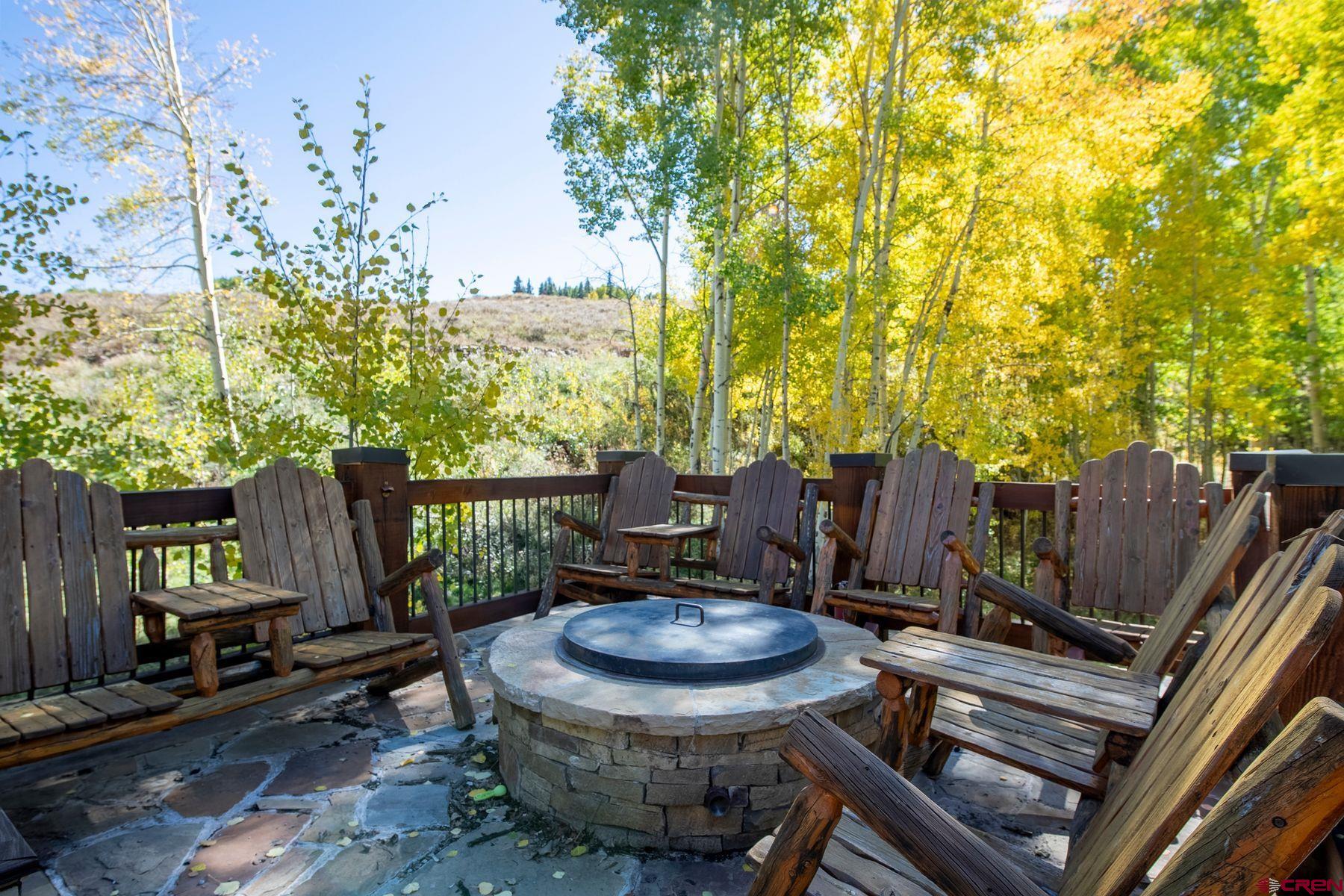 796 Red Mountain Ranch Road Crested Butte, CO 81224 - Photo 11 of 45 a view of a chairs and table in backyard