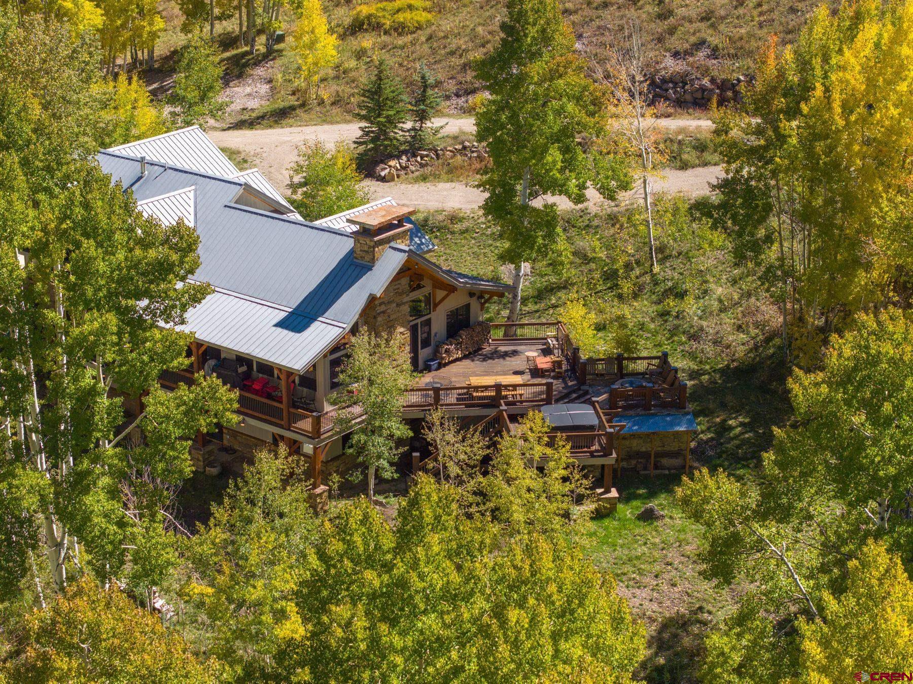 796 Red Mountain Ranch Road Crested Butte, CO 81224 - Photo 22 of 45 a view of a house with a yard