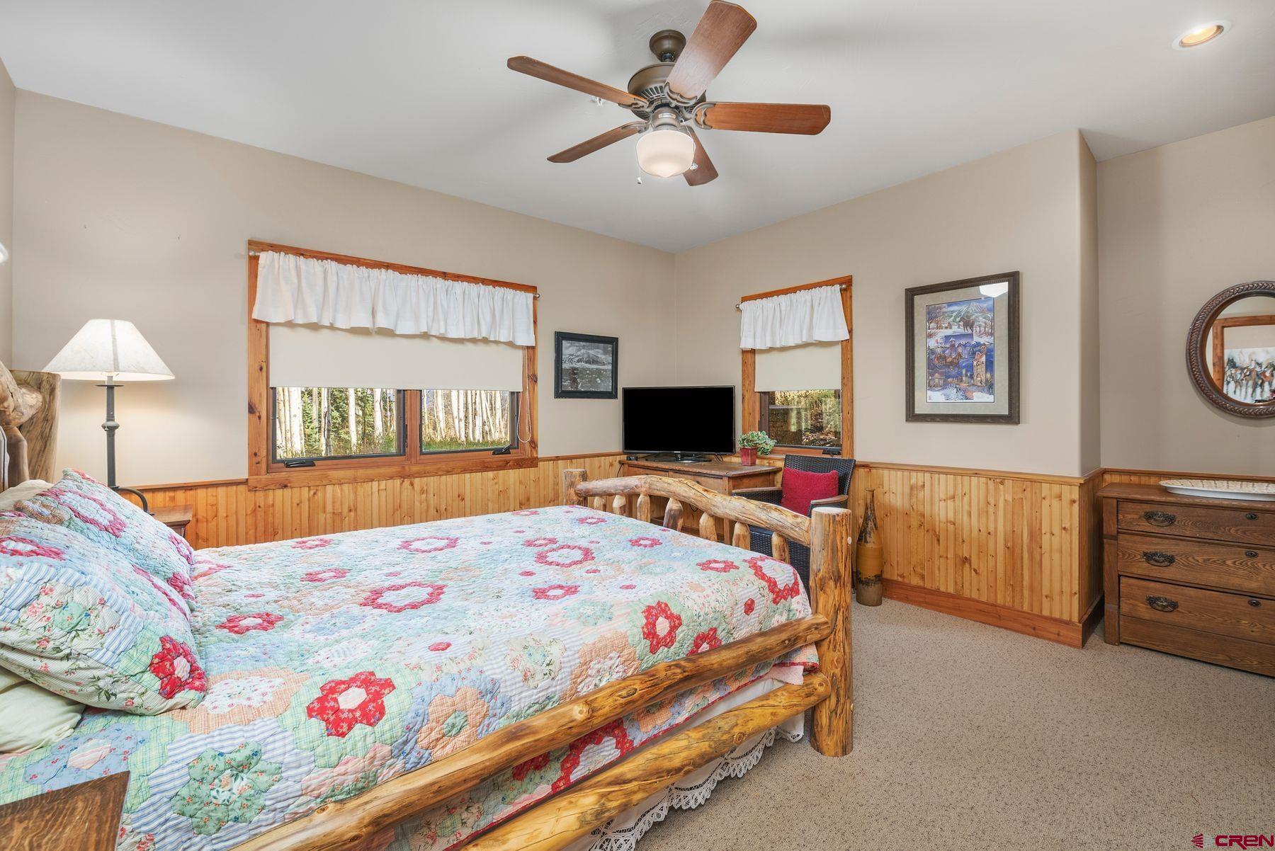 796 Red Mountain Ranch Road Crested Butte, CO 81224 - Photo 30 of 45 a bedroom that has a bed and a table in it