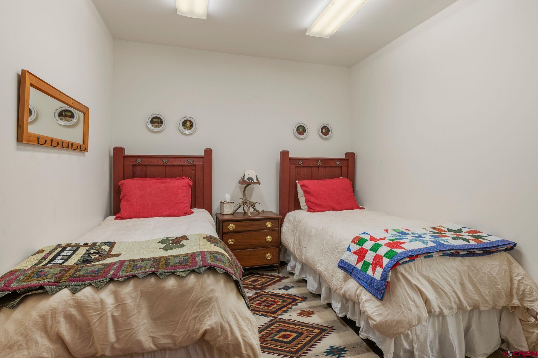 796 Red Mountain Ranch Road Crested Butte, CO 81224 - Photo 32 of 45 a bedroom with two beds and a couch
