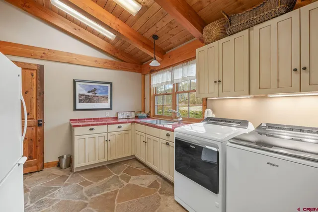 a room with furniture a bookshelf and a large window