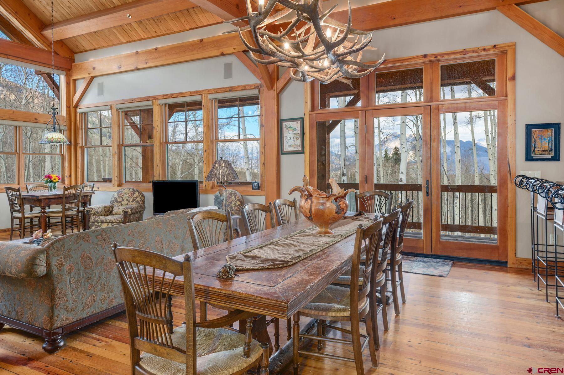 796 Red Mountain Ranch Road Crested Butte, CO 81224 - Photo 4 of 45 a view of a dining room with furniture window and wooden floor