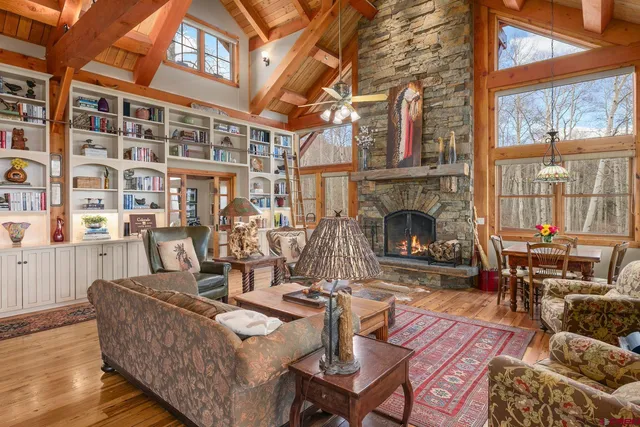 a living room with fireplace furniture and a fireplace