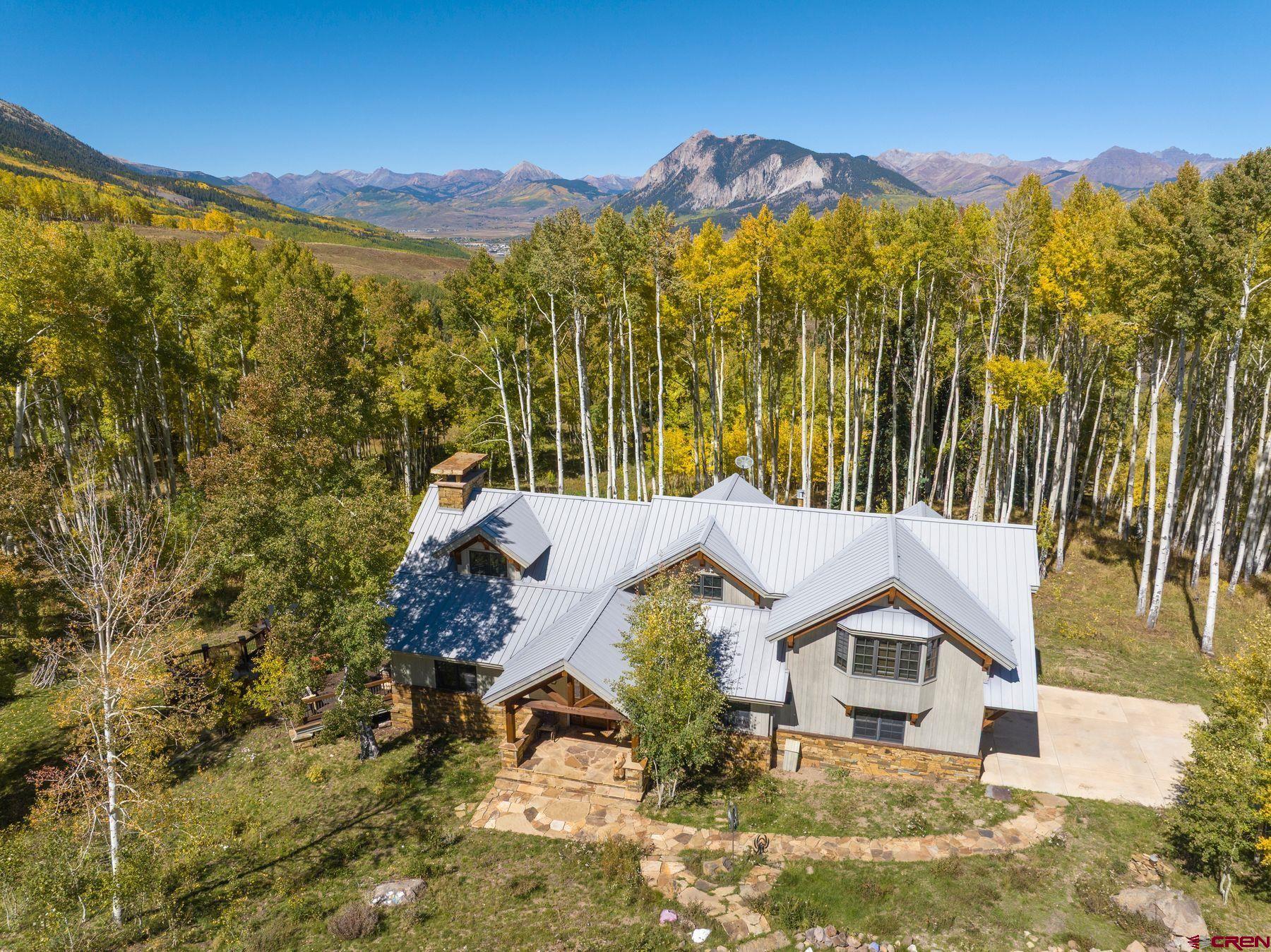 796 Red Mountain Ranch Road Crested Butte, CO 81224 - Photo 8 of 45 a view of a house with a mountain