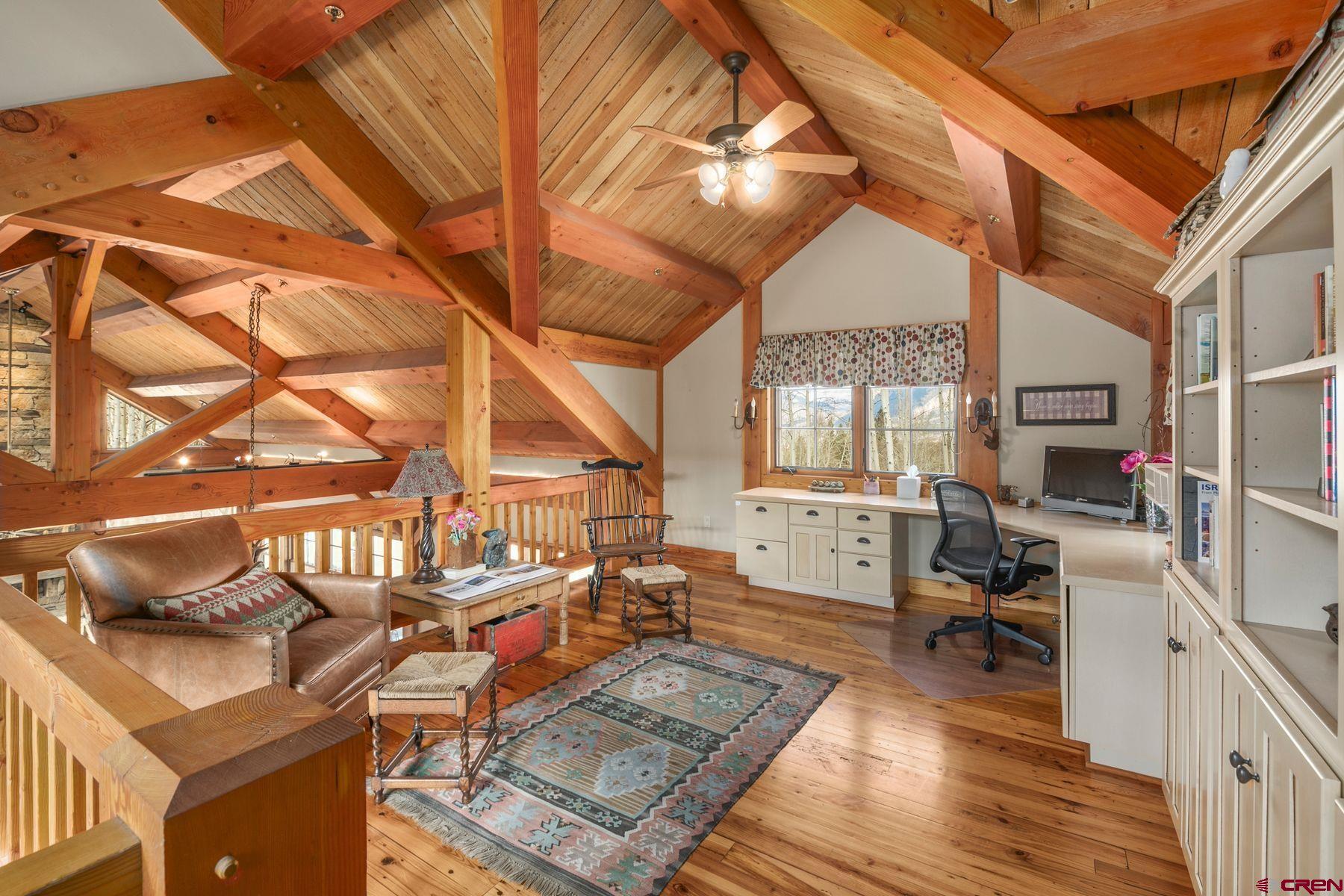 796 Red Mountain Ranch Road Crested Butte, CO 81224 - Photo 10 of 45 a living room with a couch and a table