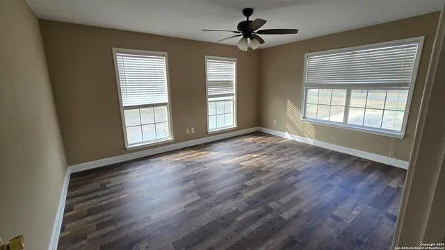 a bathroom with a sink a vanity and a bathtub