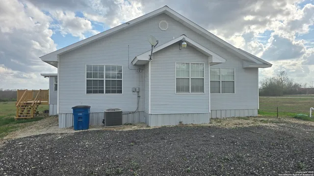a house view with a garden space