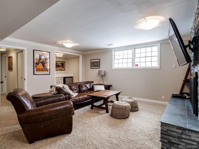 a view of a workspace with furniture and a workspace