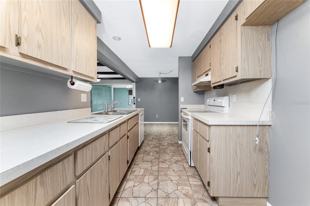 442 Kostner Street Port Charlotte, FL 33954 - Photo 18 of 69 a kitchen with white cabinets