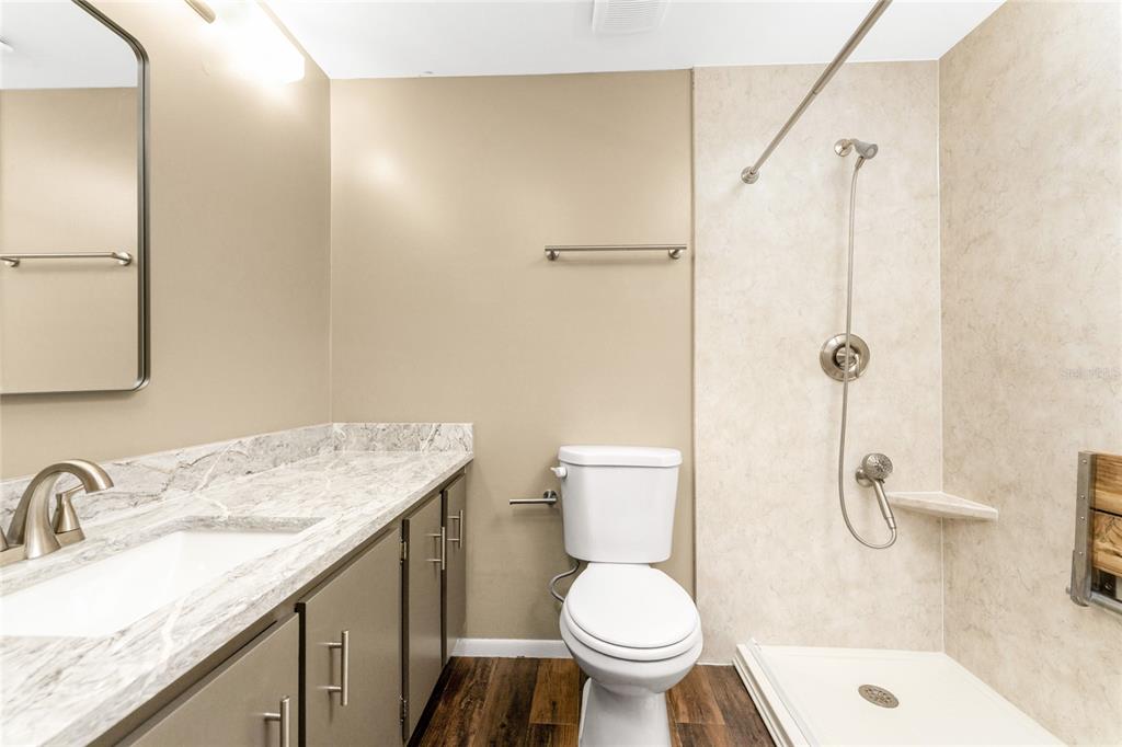 442 Kostner Street Port Charlotte, FL 33954 - Photo 34 of 69 a bathroom with a granite countertop sink toilet and shower