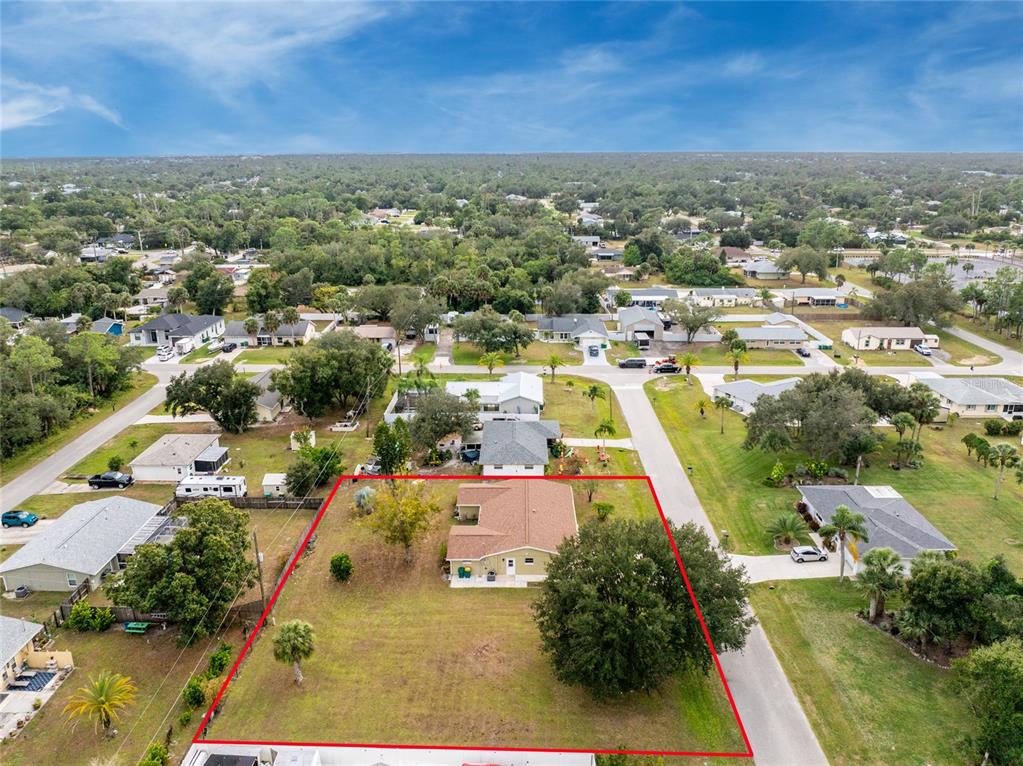442 Kostner Street Port Charlotte, FL 33954 - Photo 56 of 69 an aerial view of residential houses with outdoor space