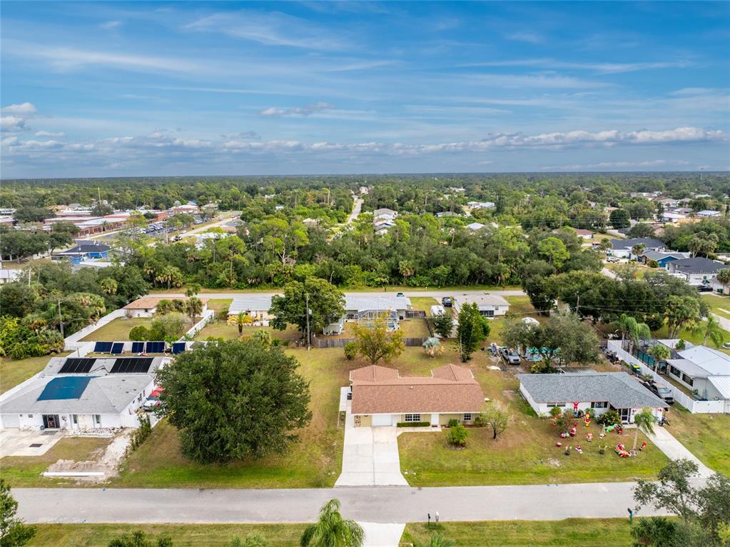 442 Kostner Street Port Charlotte, FL 33954 - Photo 57 of 69 an aerial view of residential houses with outdoor space