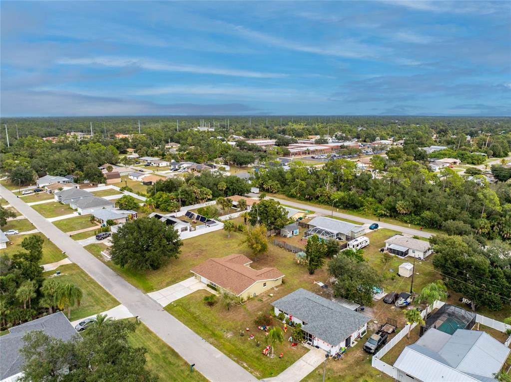 442 Kostner Street Port Charlotte, FL 33954 - Photo 61 of 69 an aerial view of residential houses with outdoor space