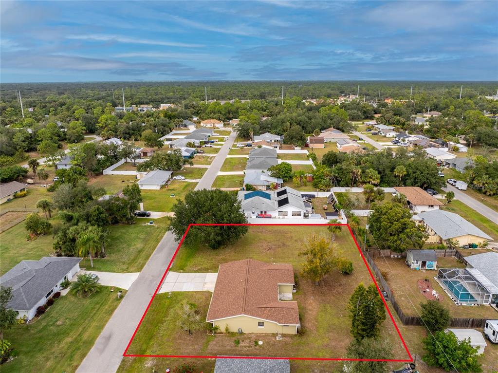 442 Kostner Street Port Charlotte, FL 33954 - Photo 62 of 69 an aerial view of residential houses with outdoor space