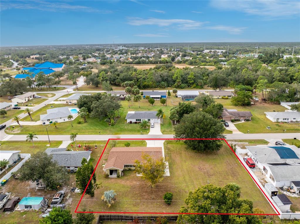 442 Kostner Street Port Charlotte, FL 33954 - Photo 64 of 69 an aerial view of residential houses with outdoor space