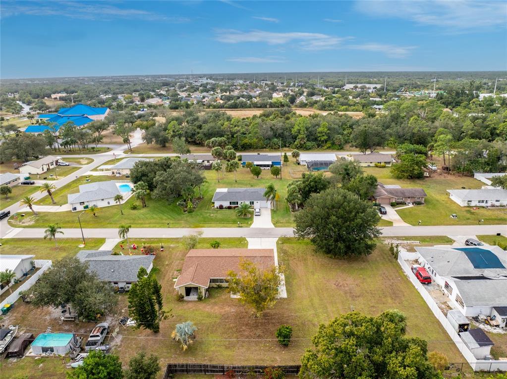 442 Kostner Street Port Charlotte, FL 33954 - Photo 65 of 69 an aerial view of residential houses with outdoor space