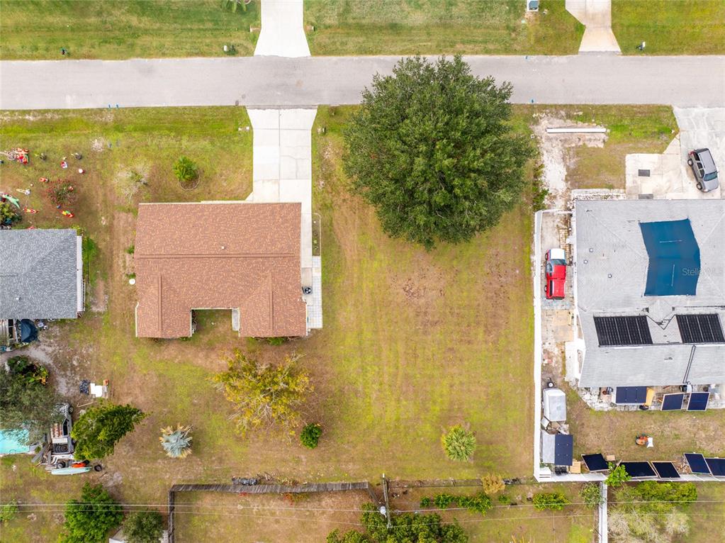 442 Kostner Street Port Charlotte, FL 33954 - Photo 67 of 69 an aerial view of residential houses with outdoor space and swimming pool