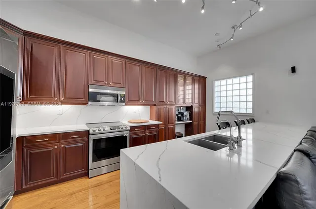 a bedroom with furniture and a window