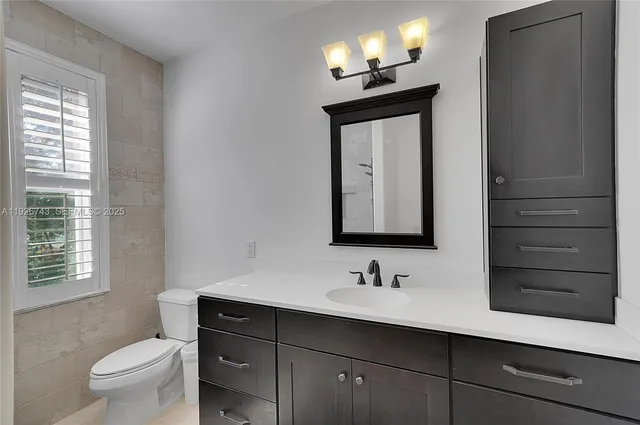 a bathroom with a sink and a shower