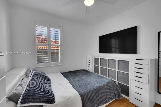 a view of a big room with closet and wooden floor