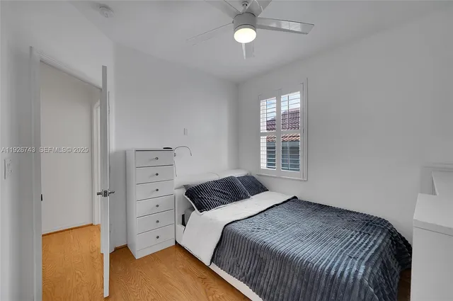 a view of a patio with table and chairs and potted plants