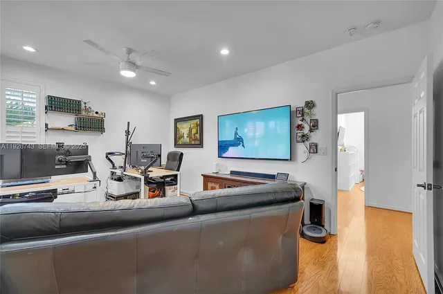 an aerial view of residential houses with outdoor space and river