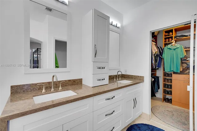 a view of a table and chairs under an umbrella